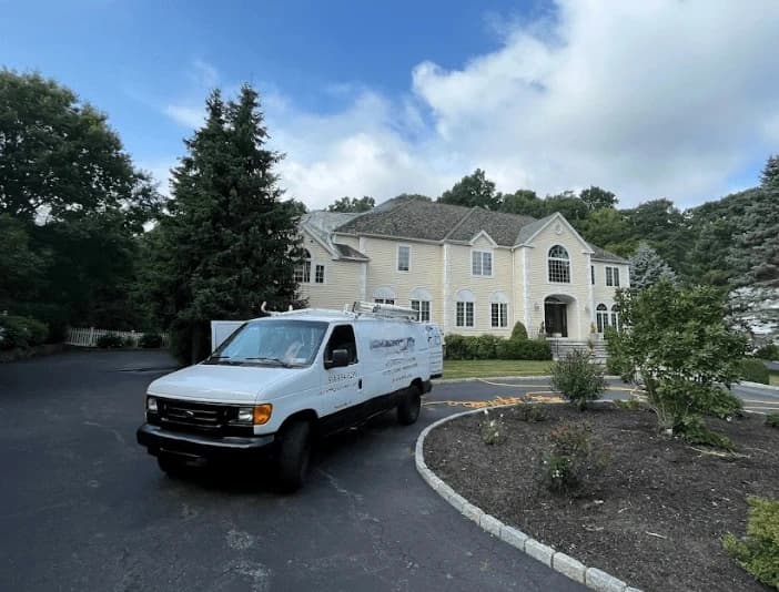 North Ridgeville Power Washing technician performing thorough gutter cleaning service in North Ridgeville